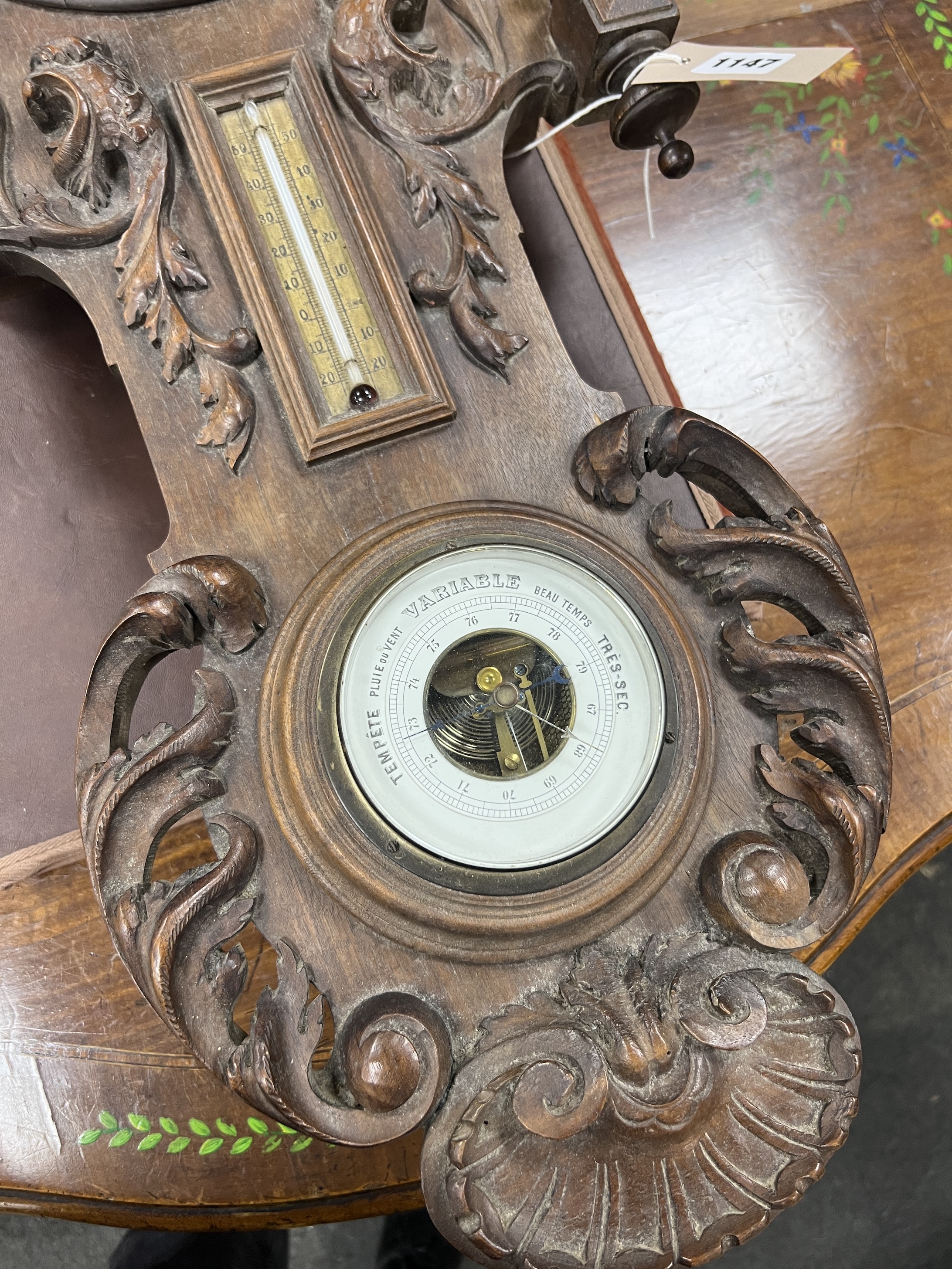 A late 19th century French carved walnut wall clock combined thermometer and barometer, dial and movement marked J Baptiste Baillon, Paris, height 93cm